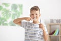 Cute little boy brushing teeth at home Royalty Free Stock Photo