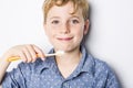 Cute little boy brushing teeth, isolated on white Royalty Free Stock Photo