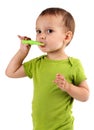 Cute little boy brushing teeth, isolated on white Royalty Free Stock Photo