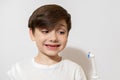 Cute little boy brushing teeth, isolated on white Royalty Free Stock Photo