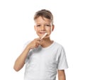 Cute little boy brushing teeth on white background Royalty Free Stock Photo