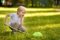 Cute little boy catches butterflies with scoop-net on sunny meadow.Study of nature. Young naturalist Royalty Free Stock Photo