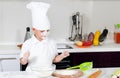 Cute little boy chef in the kitchen Royalty Free Stock Photo