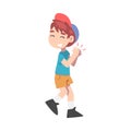 Cute Little Boy Clapping his Hands, Joyful Kid Wearing Shorts, T-shirt and Baseball Cap Expressing Enjoyment