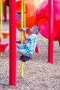 Little boy climbing on playground equiptment