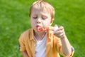 cute little boy with closed eyes blowing soap bubbles Royalty Free Stock Photo