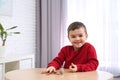 Cute little boy with coins. Counting money Royalty Free Stock Photo