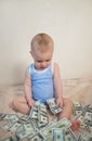 Cute little boy is counting money Royalty Free Stock Photo