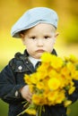 Cute little boy with dandelions Royalty Free Stock Photo