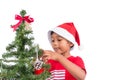 Cute little boy decorating Christmas tree Royalty Free Stock Photo