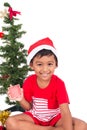 Cute little boy decorating Christmas tree Royalty Free Stock Photo