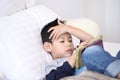 Cute little boy with digital tablet, early learning.asian boy playing game on the bedroom.