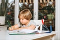 Cute little boy doing homework for school Royalty Free Stock Photo