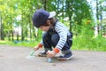 Cute little boy drawing chalk on the ground Royalty Free Stock Photo