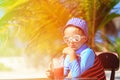 Cute little boy drinking juice on tropical beach Royalty Free Stock Photo