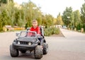 Cute little boy driving a toy truck Royalty Free Stock Photo