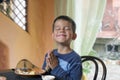 Cute little boy eating breakfast Royalty Free Stock Photo