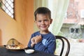Cute little boy eating breakfast Royalty Free Stock Photo