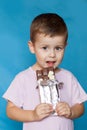 Cute Little Boy Eating Chocolate Bar. Very cute kid with chocolate, . Royalty Free Stock Photo