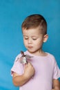 Cute Little Boy Eating Chocolate Bar. Very cute kid with chocolate, . Royalty Free Stock Photo