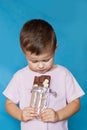 Cute Little Boy Eating Chocolate Bar. Very cute kid with chocolate, . Royalty Free Stock Photo