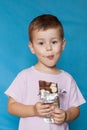 Cute Little Boy Eating Chocolate Bar. Very cute kid with chocolate, . Royalty Free Stock Photo