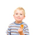 Cute little boy eating delicious cookie isolated