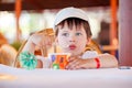 Cute little boy eating ice cream at indoor cafe Royalty Free Stock Photo