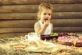 Cute little boy eats berries Royalty Free Stock Photo