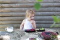 Cute little boy eats berries Royalty Free Stock Photo