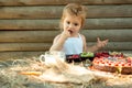 Cute little boy eats berries Royalty Free Stock Photo