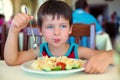 Cute little boy enjoying food Royalty Free Stock Photo