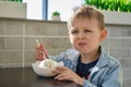 Cute little boy enjoying ice cream in cafe Royalty Free Stock Photo