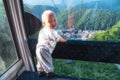 Cute little boy enjoying ride in cable car during summer vacation, travel with children Royalty Free Stock Photo