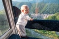 Cute little boy enjoying ride in cable car during summer vacation, travel with children Royalty Free Stock Photo