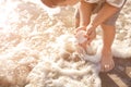 Cute little boy gathering sea shells on beach Royalty Free Stock Photo