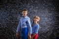 Cute little boy and girl in front of a big Royalty Free Stock Photo