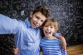 Cute little boy and girl in front of a big Royalty Free Stock Photo
