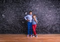 Cute little boy and girl in front of a big blackboard. Royalty Free Stock Photo