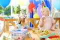 Cute little boy and girl having fun and celebrate birthday party with colorful decoration and cake Royalty Free Stock Photo