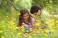 Cute Little Boy and Girl Outside in a Flower Field