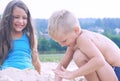 Cute little boy and girl playing on the beach. Summer vacation concept. Royalty Free Stock Photo