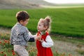 A little boy giving flowers to a girl. The concept of love Royalty Free Stock Photo