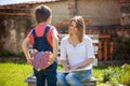 Cute little boy, giving present to his mom for Mothers day in th Royalty Free Stock Photo