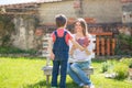 Cute little boy, giving present to his mom for Mothers day in th Royalty Free Stock Photo