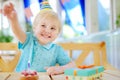 Cute little boy having fun and celebrate birthday party with colorful decoration and cake Royalty Free Stock Photo