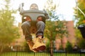 Cute little boy having fun on outdoor playground. Child on swing