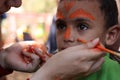 Cute Little boy having his face painted Kids having fun playing Royalty Free Stock Photo
