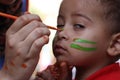 Cute Little boy having his face painted Kids having fun playing Royalty Free Stock Photo