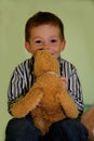 Cute little boy and his cuddling toy Royalty Free Stock Photo